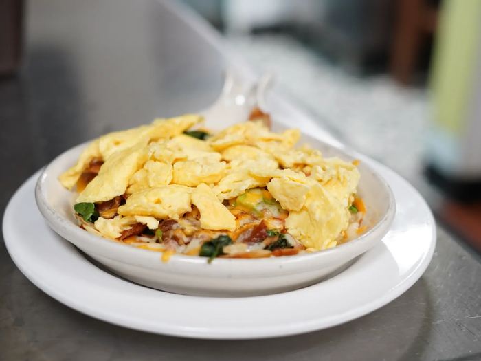 Grandma's Skillet served hot in a bowl and topped with eggs.