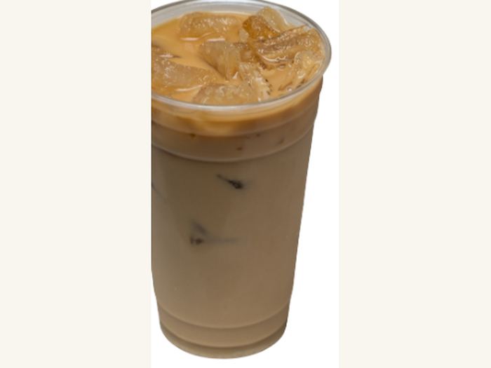 A tall iced coffee horchata over ice.