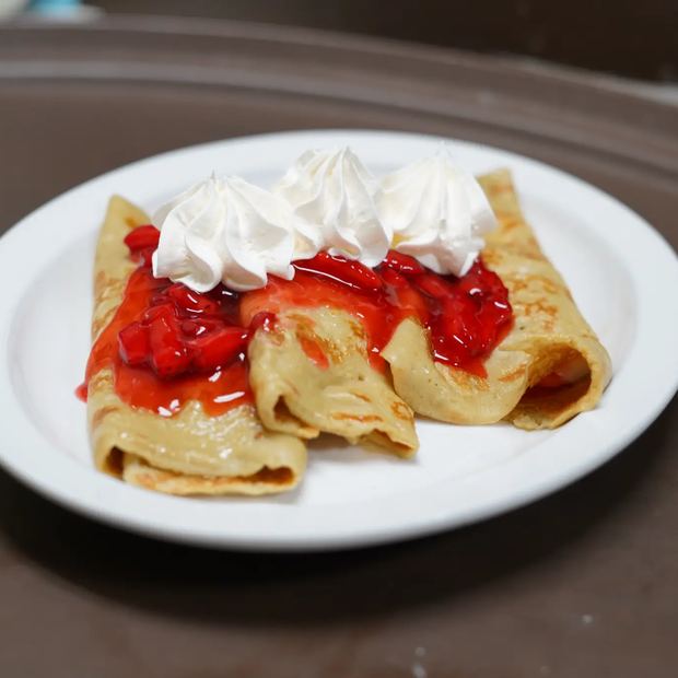 House crepes served with strawberries and cream cheese.